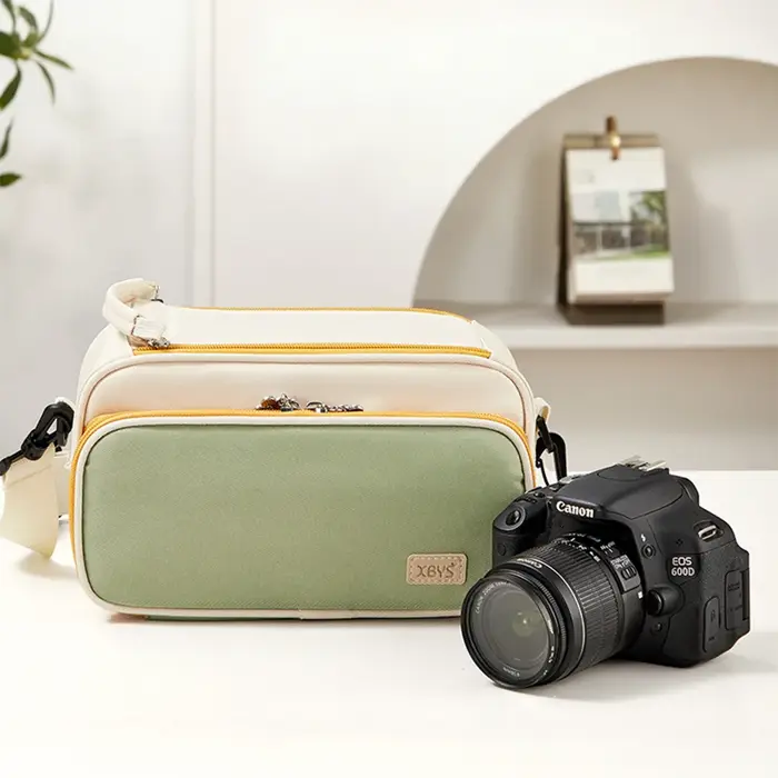Sac de rangement pour appareil photo avec design bicolore, comprenant un sac pour ranger l'équipemen