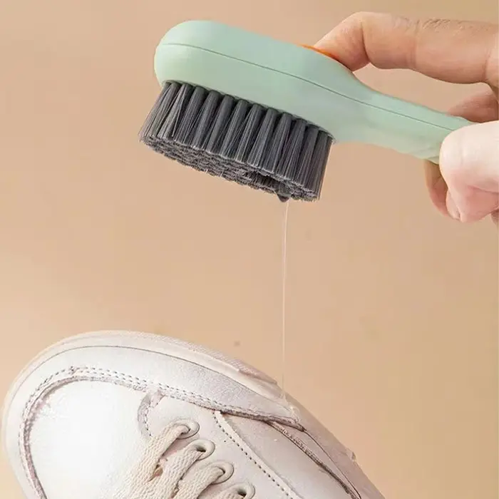 Brosse à chaussures multifonctionnelle à décharge automatique de liquide